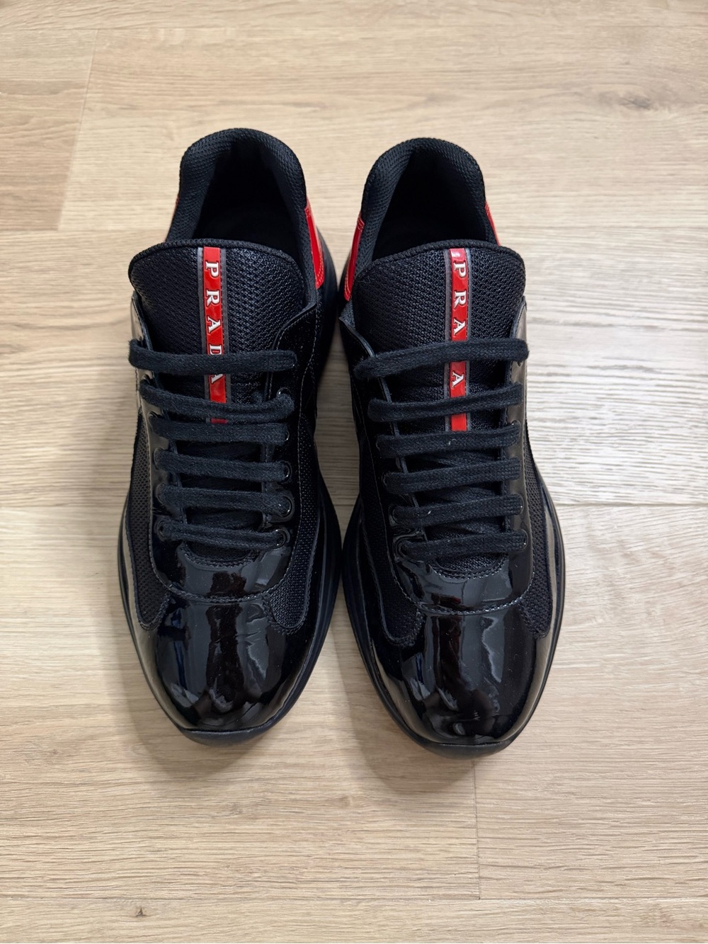Prada Black Sneakers with Red Logo Stripe